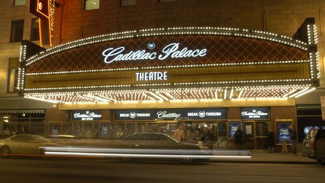 A picture of the cadillac palace theatre at night.