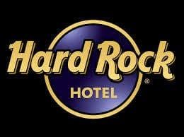 A logo of the hard rock hotel in black background.